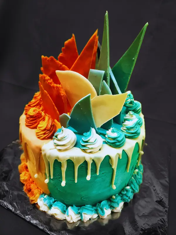 Teal drip cake with orange chocolate shards made by Deli-icious! Catering in Bloemfontein