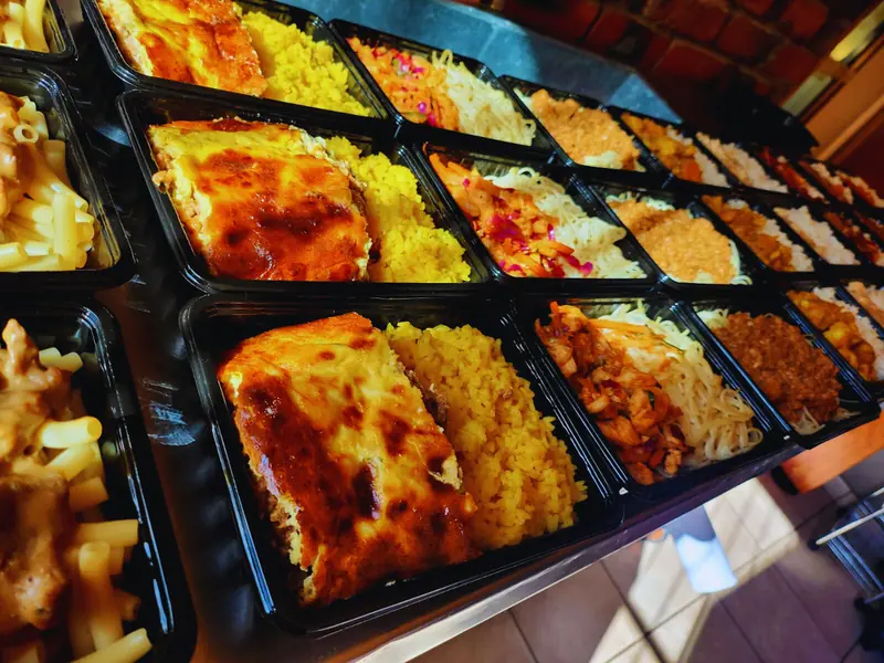 Trays of home-style frozen dinners including lasagne and pasta from Deli-icious! Catering Bloemfontein