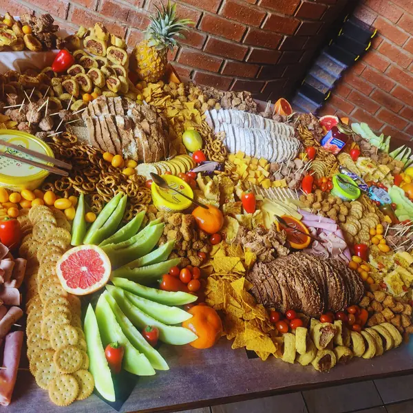 Harvest table with pineapple, fruit and savoury bites for a Bloemfontein function