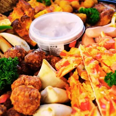 Savoury platter with samosas, meatballs and sausages from Deli-icious! Catering