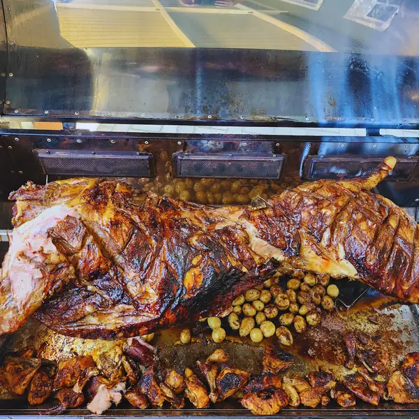 Spit-roasted lamb being carved at a Bloemfontein year-end function