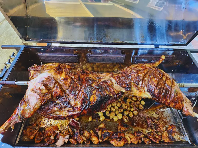 Whole lamb roasting golden-brown on a Deli-icious! gas spitbraai in Bloemfontein
